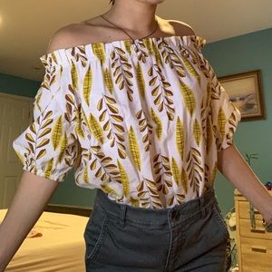 White and yellow off the shoulder flower leaf top
